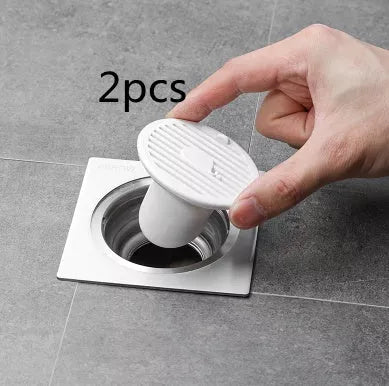 Whale Magnetic Suction Floor Drain Cover in white, orange, or green, blocking sewer odors with a tight seal