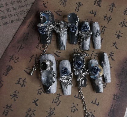 Heavy industry night blue plastic nail armour suit with ornate rose and tulip pattern, shown in size L.