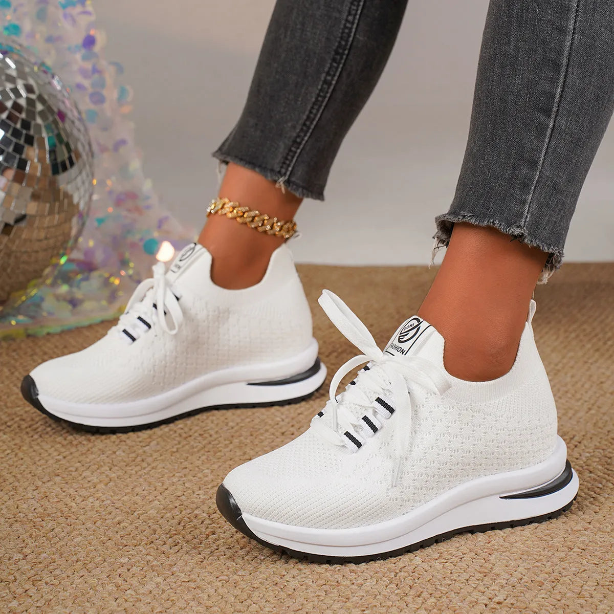 Women's black mesh lace-up platform sneakers with a round toe and flat rubber sole on a white background.