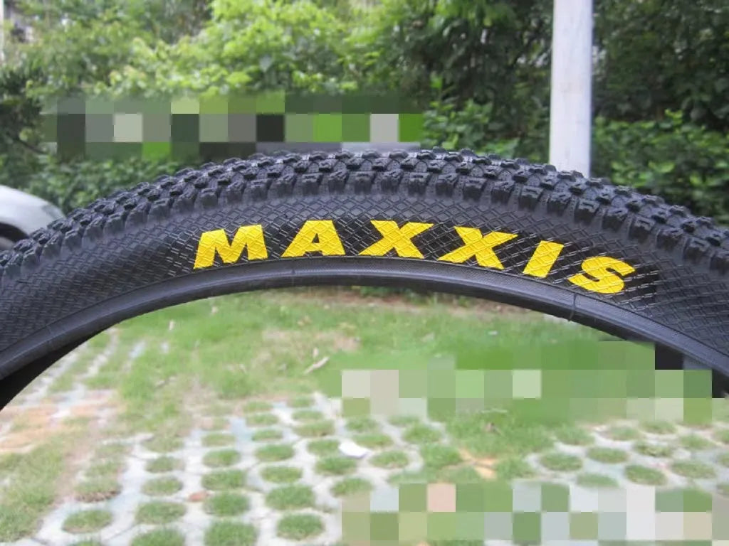 Mountain bike tyre with ultralight design, showing tread pattern and white label option, sizes from 26 to 29 inches.