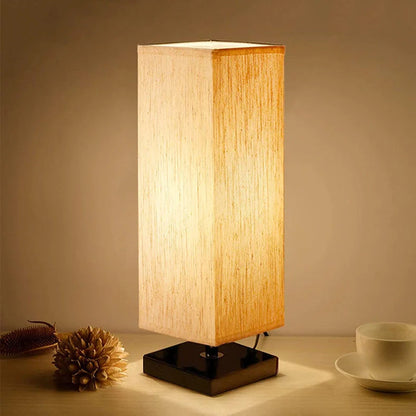 Modern square table lamp with linen cloth cover and petal-shaped design measuring 10.5cm