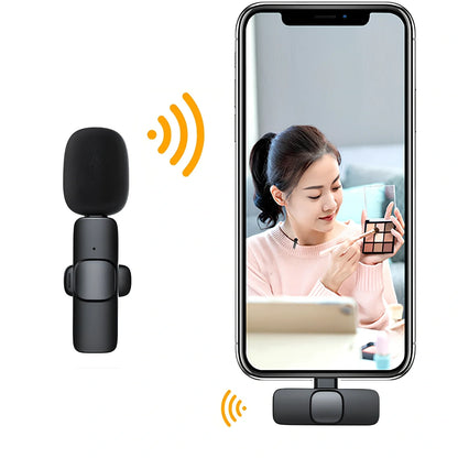 Wireless lavalier microphone with clip showing compact 130x90x25mm dimensions and multiple interface connectors
