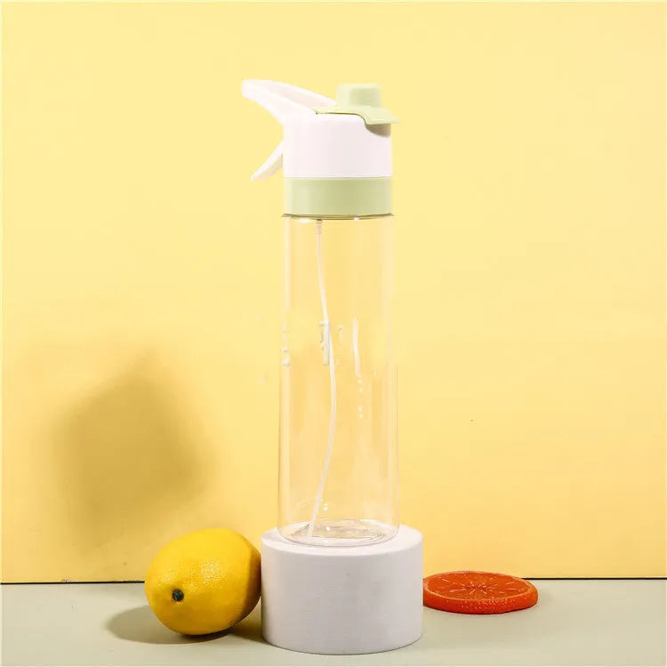 Large plastic spray water bottle with handle strap and leakproof lid in green colour.