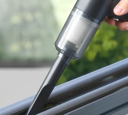 Black cordless car vacuum with suction head and brush attachment, 16.5cm size