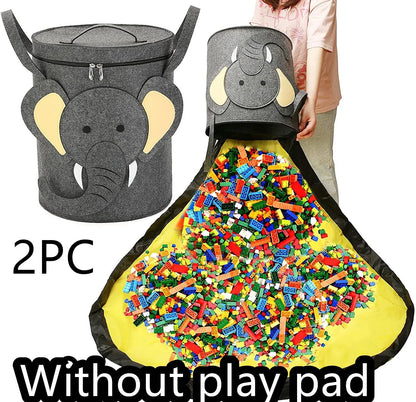 Green felt storage cube with pull rope unfolded into a large square play mat on a wooden floor.