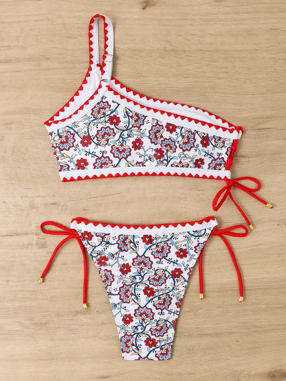 Blue one-shoulder floral bikini set on a mannequin, showing front and back views.