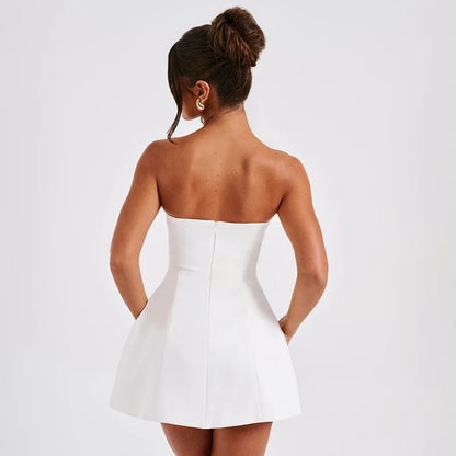 Backless women's tube dress in solid colour with high waist and A-line short skirt.