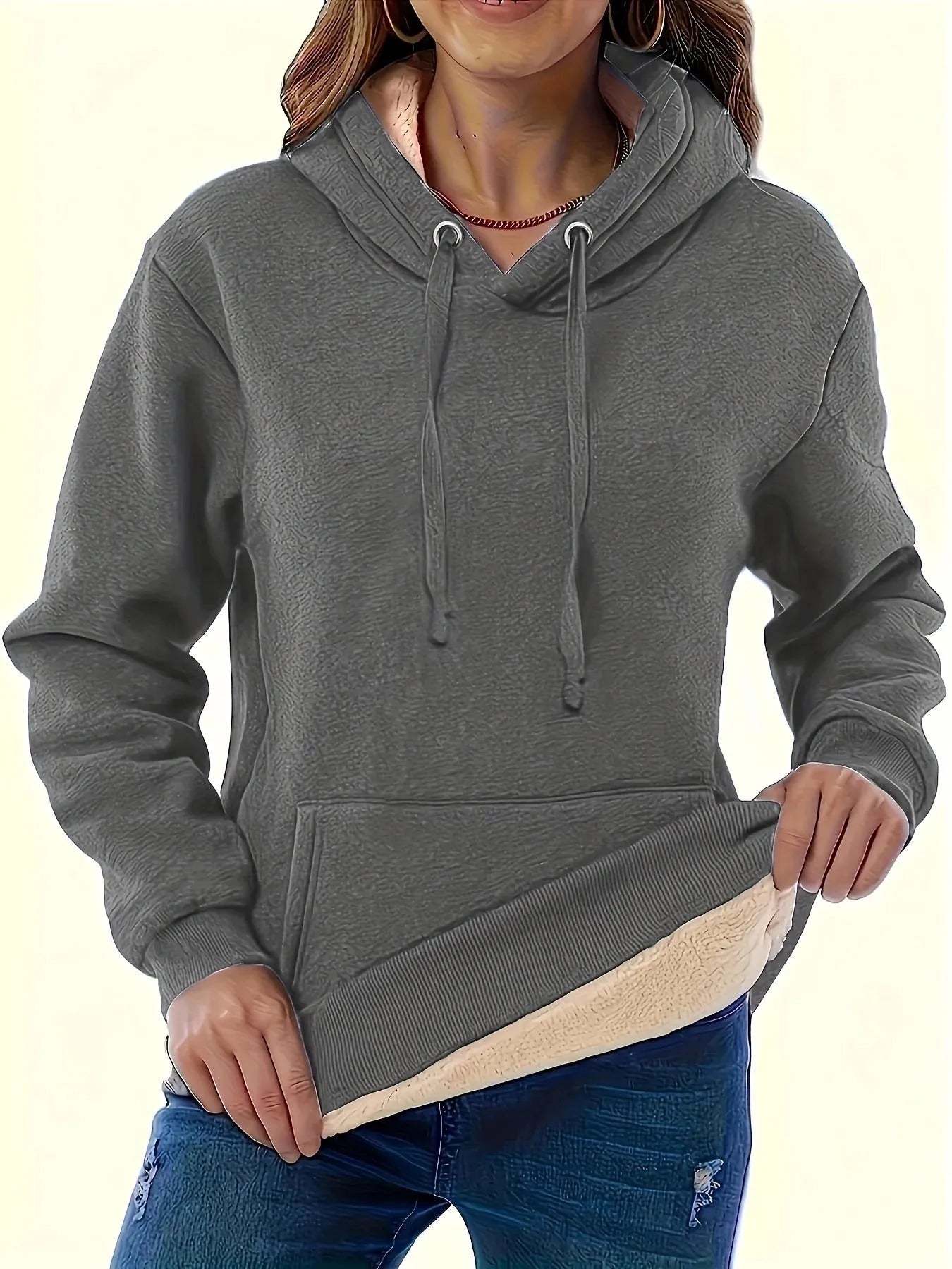 Women's loose fit hooded sweater in thick grey polyester fleece with 3D pattern and front pockets.