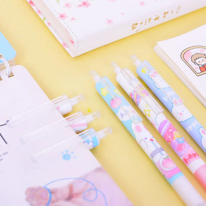 Six black ballpoint pens with cartoon bunny designs showing 0.5mm tips for writing