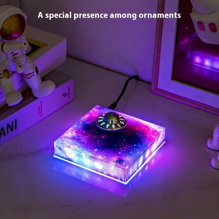 Levitating UFO Galaxy Lamp with color-changing RGB lighting, magnetic suspension, and a glowing galaxy base