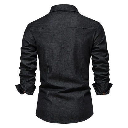 Men's solid colour slim fit cotton denim shirt with long sleeves and button front.