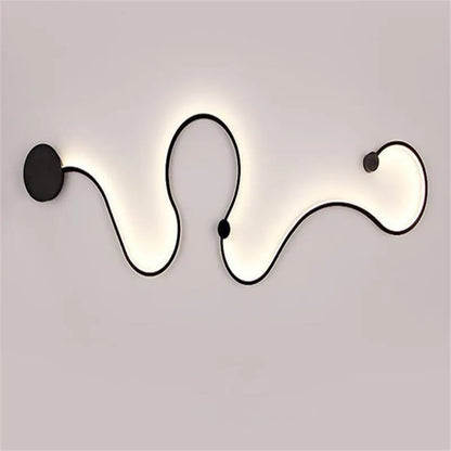 Modern black and white LED wall lamp with aluminium shade in four different sizes for bedside or corridor lighting