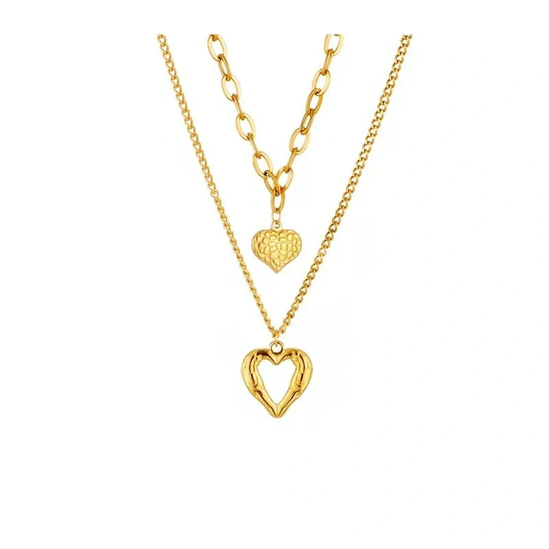Stylish Titanium Steel Angel Wings Heart Necklace for Women in silver and golden finishes.