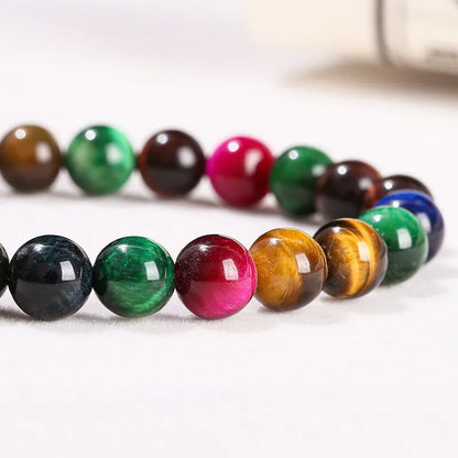 Colourful tiger eye gemstone bracelet with geometric round beads in assorted earthy tones.