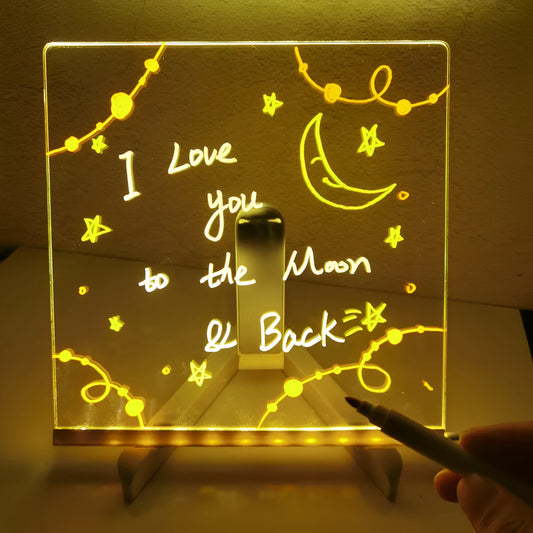 Acrylic DIY message board LED night light on bracket with pen, showing writable transparent surface.
