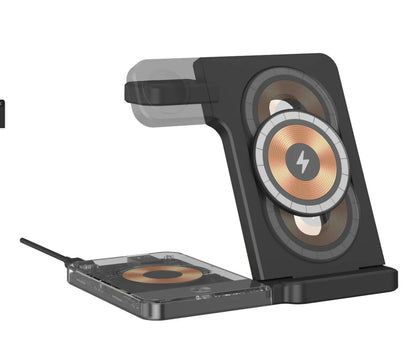 Black foldable three-in-one magnetic wireless charging stand for phone, watch and earphones on a desk.