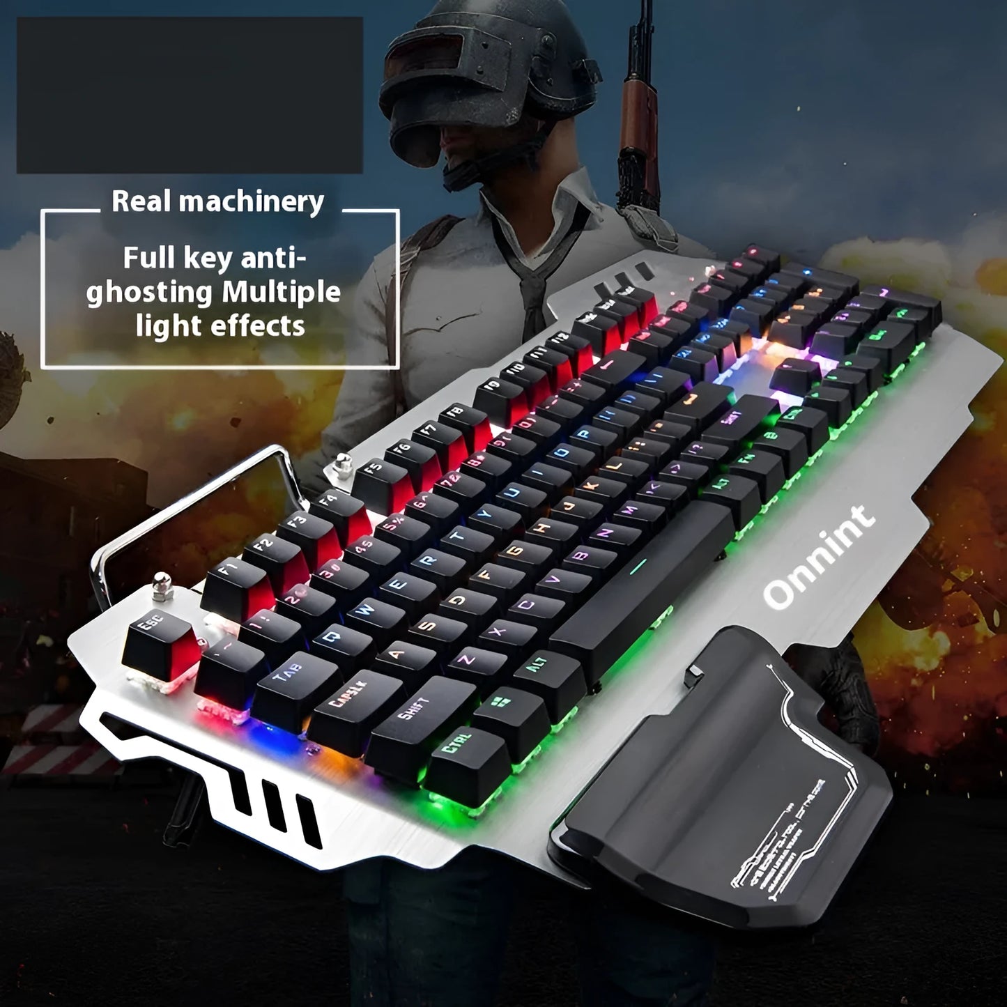 Silver metal gaming keyboard with integrated wrist rest and green mechanical keys on desktop