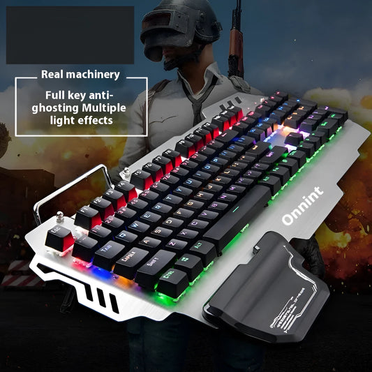 Silver metal gaming keyboard with integrated wrist rest and green mechanical keys on desktop