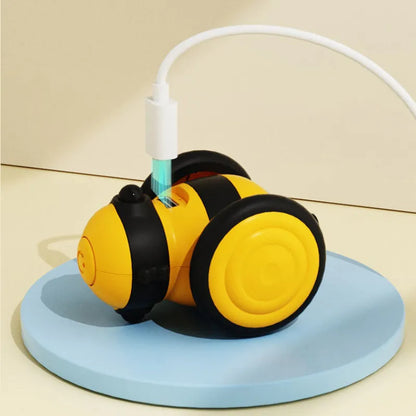 Electric bee-shaped cat car toy with feather teaser moving on floor