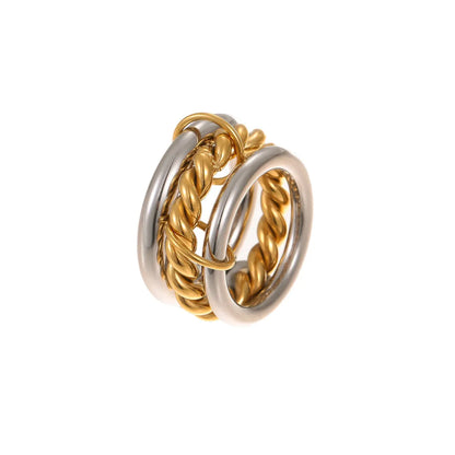 Stacked stainless steel rings with 18K gold plating in three colour variations, exaggerated hand jewellery designs