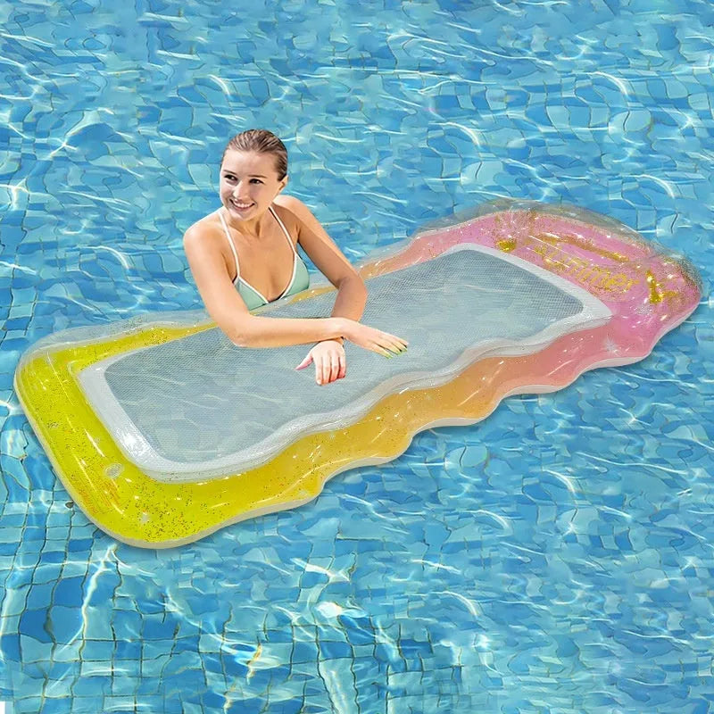 Vibrant gradient blue and purple sequined inflatable pool float lounger on water