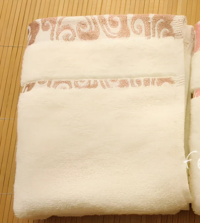 Pure cotton jacquard face towel measuring 33x73cm with textured patterns and twistless yarn construction