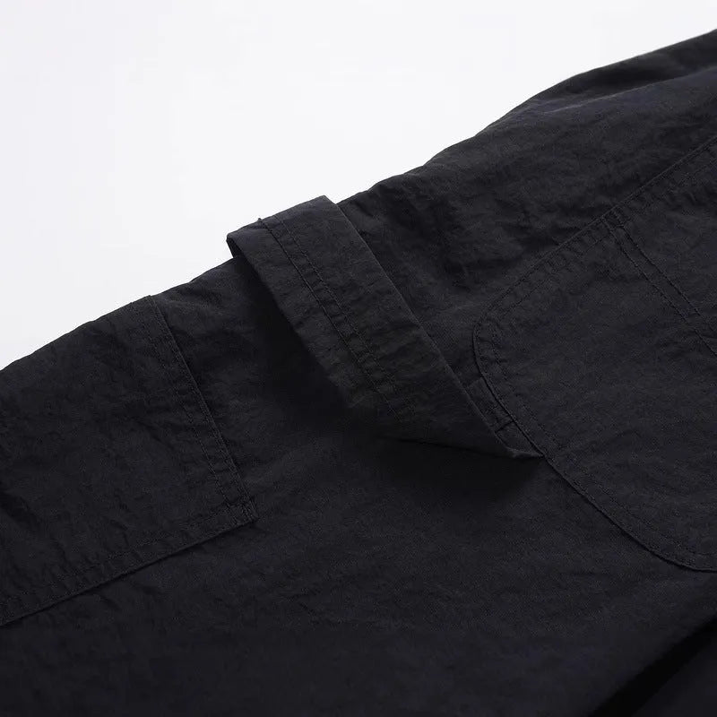 Black tooling paratrooper pants with elastic waist drawstring closure and baggy three-dimensional cutting