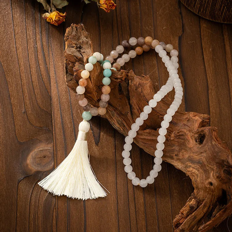 Vintage bohemian-style long beaded sweater chain with a tassel, showing necklace and bracelet lengths.