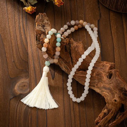 Vintage bohemian-style long beaded sweater chain with a tassel, showing necklace and bracelet lengths.
