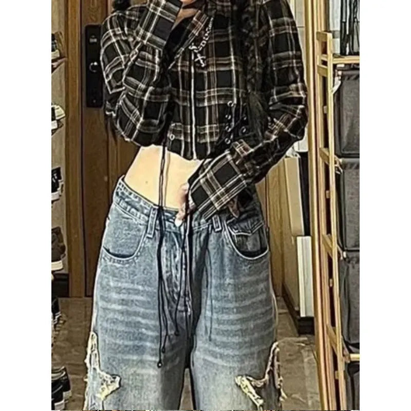 Blue high-waisted women's wide-leg denim jeans on a neutral background.