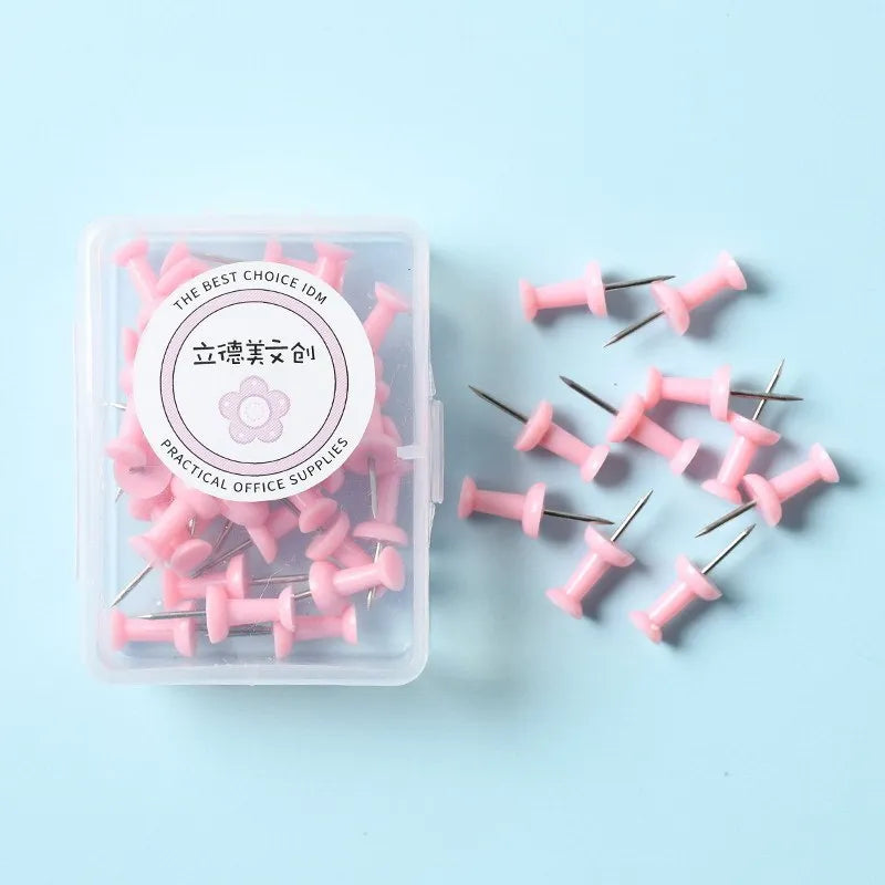 Macaron colour plastic push pins in cherry blossom pink, mint green and lavender, available in large and small sizes
