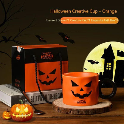 Ceramic pumpkin-shaped mugs in orange and white colors, featuring a sturdy handle and festive holiday design