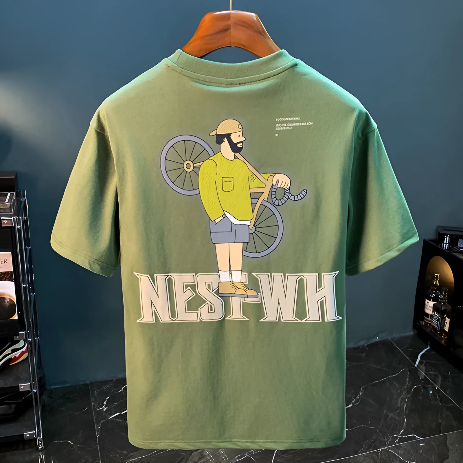 Green men's loose fit t-shirt with 'Literary Youth' text print on the front.