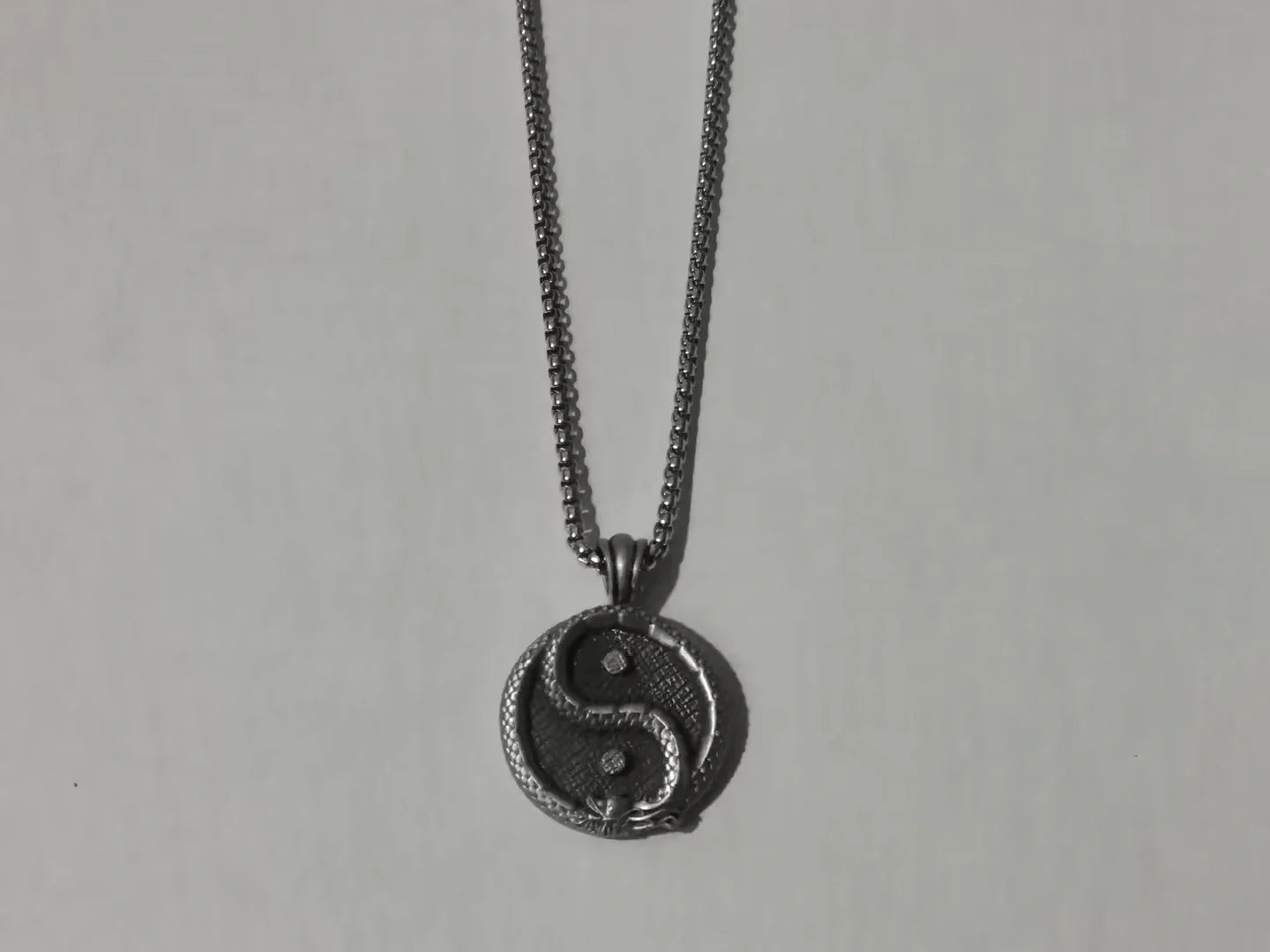 Stylish personalized pendant necklace for men made of titanium steel with a polished black finish