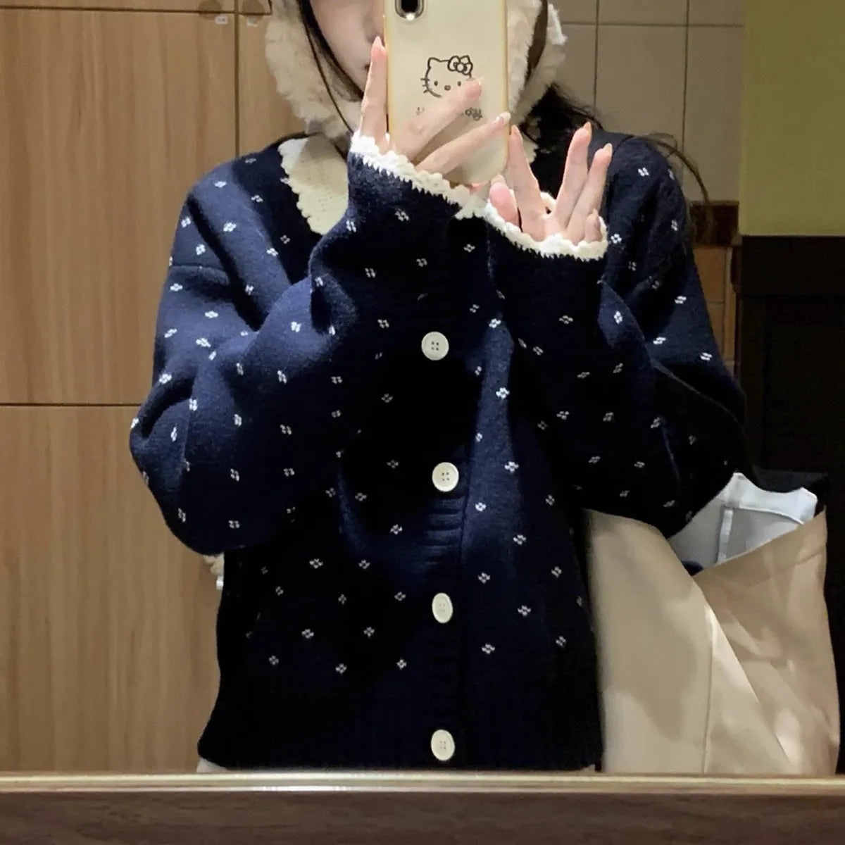 Retro floral patterned cardigan coat with a Peter Pan collar and button front.