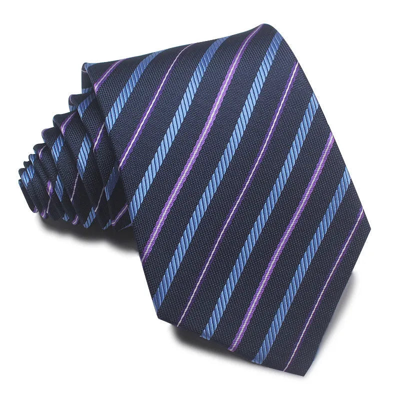 Close-up of a red and black striped jacquard weave tie with an arrow tip, showing texture.