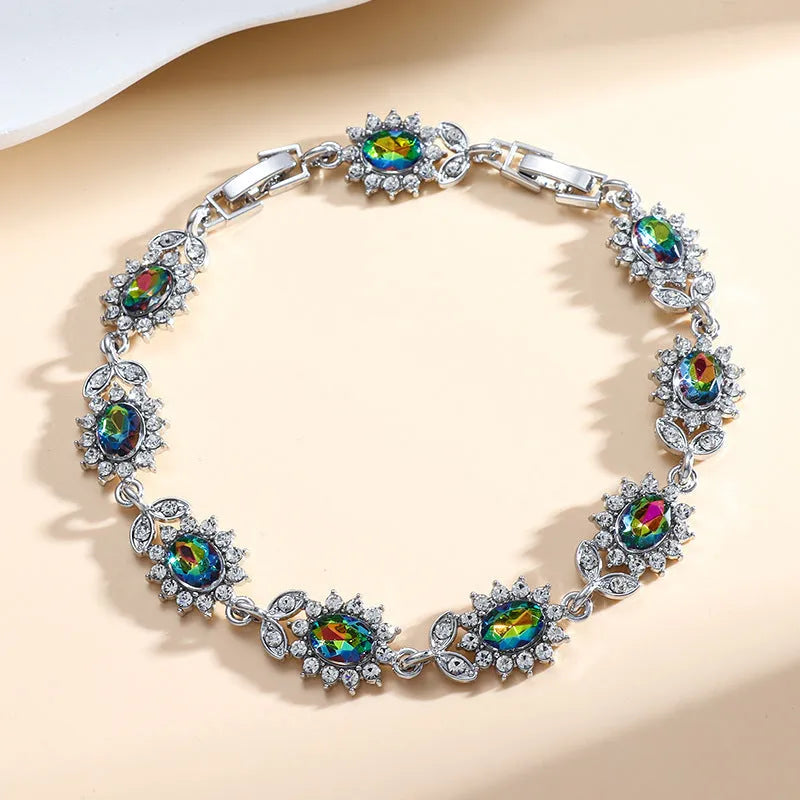 Personality Trend adjustable alloy bracelet with inlaid zircon stones in a choice of nine gemstone colours on a wrist.