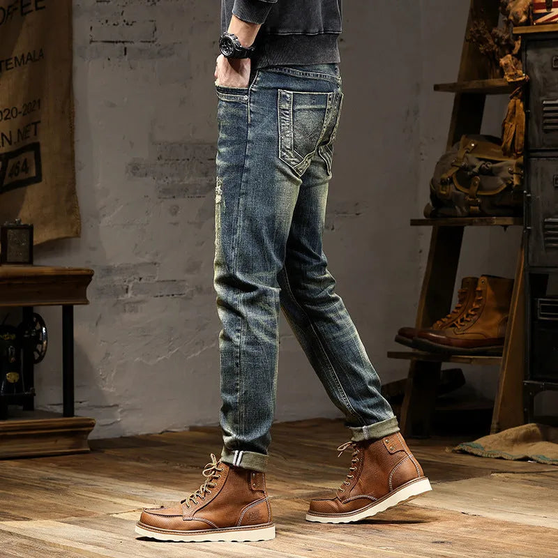 Men's skinny fit stretch denim jeans in retro colour with zip fly, shown in leisure setting.
