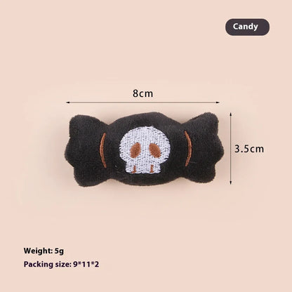 Plush cat teaser wand with candy, eyes, and skull heads on a 40cm string next to a wand handle.