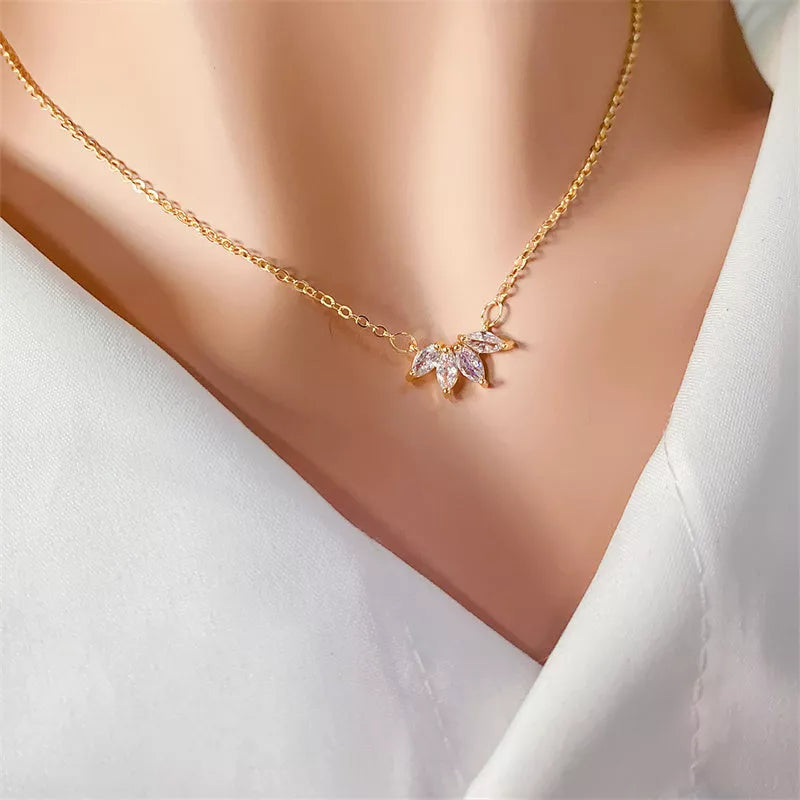 Minimalist lotus flower petal necklace in gold or silver, perfect for women and girls.