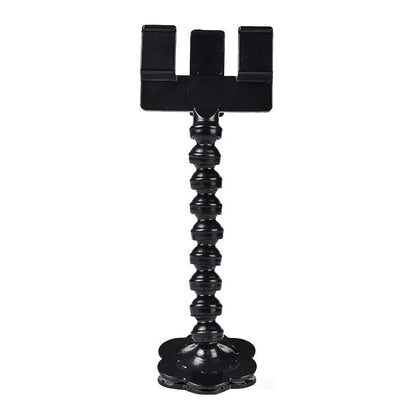 Black plastic pet photography tool attached to mobile phone with treat clip extended