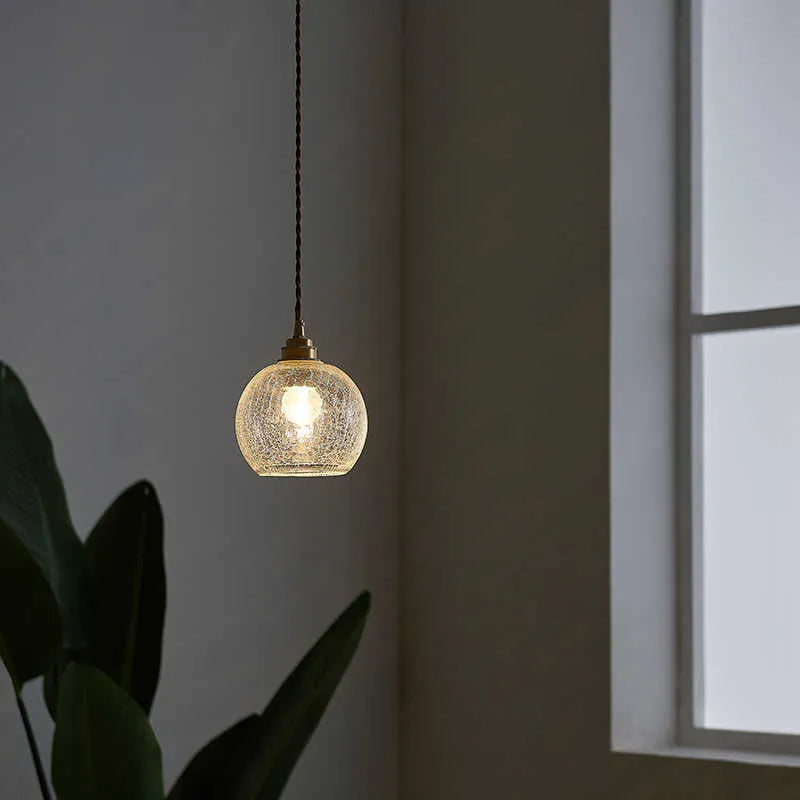 Compact spherical brass and glass ball chandelier with copper finish and clear glass shade, shown in diamond colour.