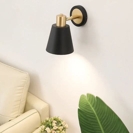 Nordic-style wall lamp with iron shade and tricolor LED lighting, mounted on a bedroom wall