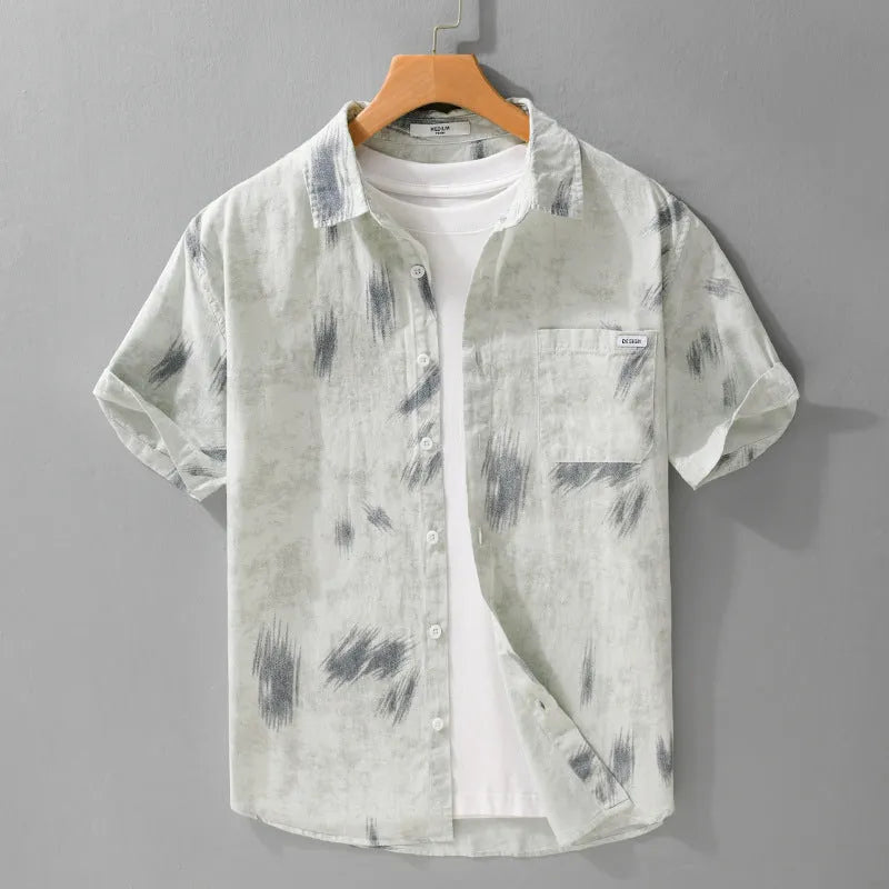 Men's light green floral print cotton cardigan with short sleeves on a hanger.