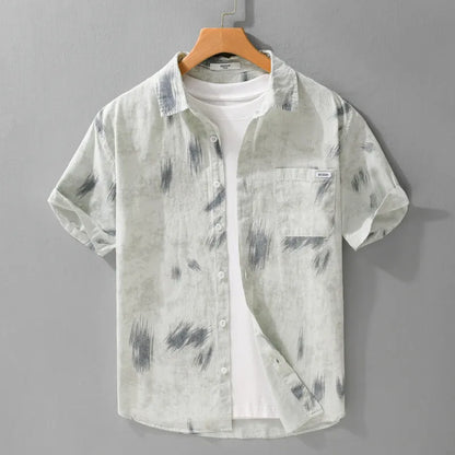 Men's light green floral print cotton cardigan with short sleeves on a hanger.
