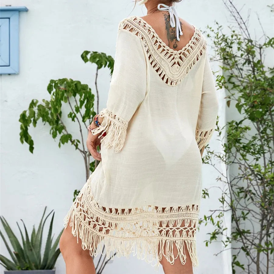 Apricot crocheted knitted patchwork beach dress with mid-length skirt and half sleeves on hanger