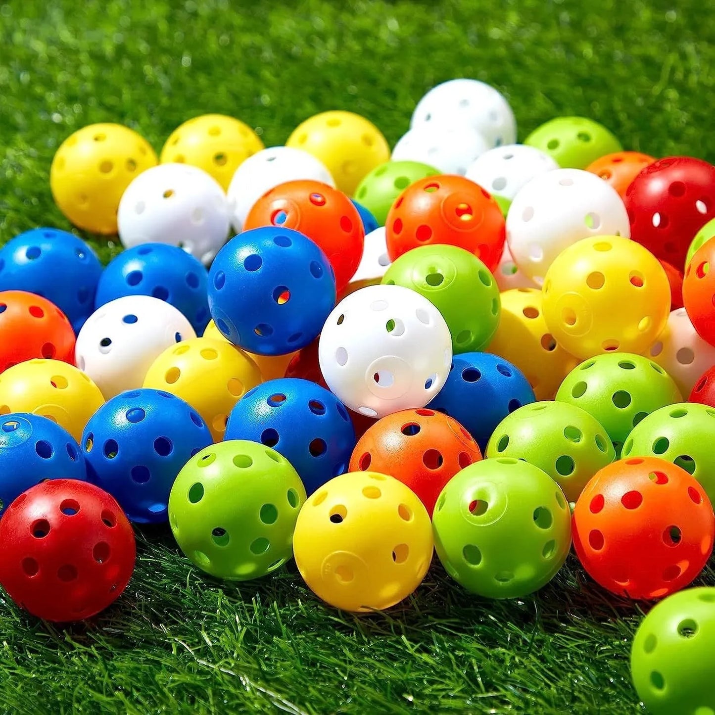 Multi-colour golf practice balls in red, orange, blue, green, white, and yellow, 42mm diameter, packed in a net pocket