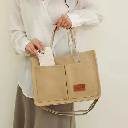 Premium canvas tote bag in multiple colors with adjustable shoulder strap and organizational pockets