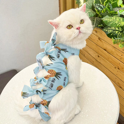 Lace-up cat sterilisation clothing in five colours including pink, purple, blue, brown, and green pineapple, showing adjustable fastening