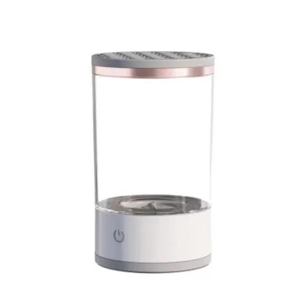 Grey and white portable electric makeup brush cleaner with USB charging cable.